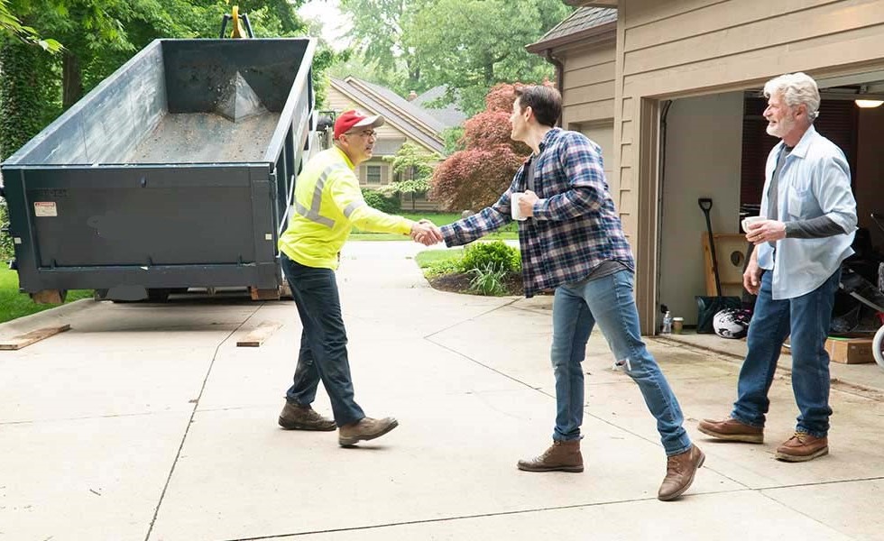 dumpster-driver-with-customer